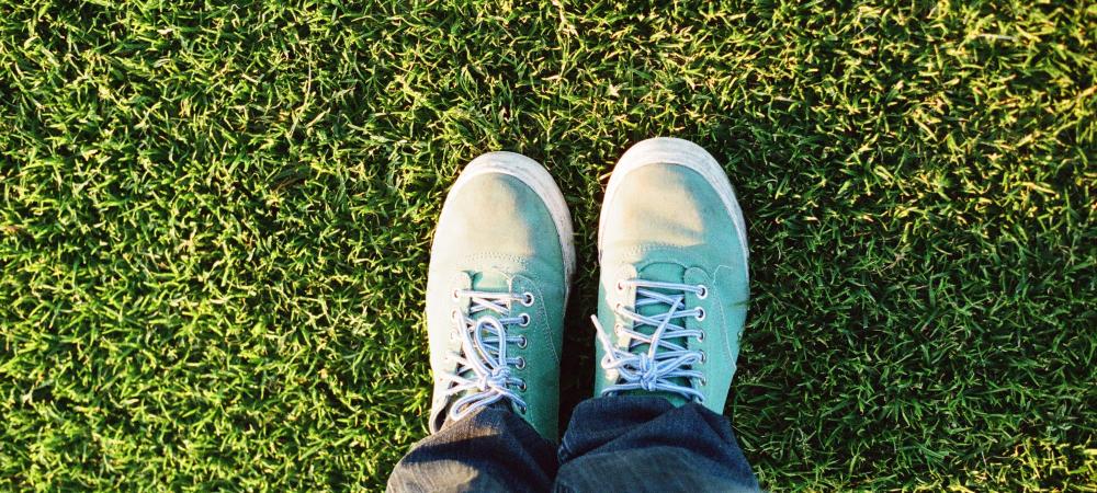 birds eye view of someones feet on grass